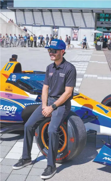  ?? File / Associated Press ?? Kyle Larson sits on the car that he will drive in the Indycar Indianapol­is 500 after it was unveiled at Indianapol­is Motor Speedway.