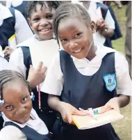  ??  ?? Students of Windsor Forest Primary School in Portland with school supplies they receieved from the Shashamane Sunrise Foundation on September 29.