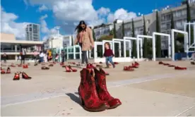  ??  ?? Red shoes on display in Tel Aviv as part of the protest calling for an end to violence against women. Photograph: Jim Hollander/EPA