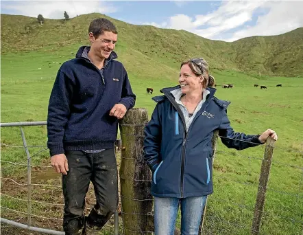  ?? GRANT MATTHEW/STUFF ?? East Taranaki cattle breeders Lance and Janelle Downs have a couple of reasons to be grateful to the Taranaki Community Rescue Helicopter.