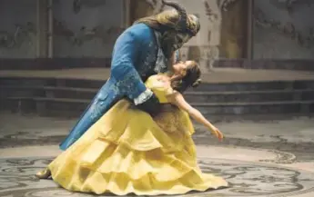  ??  ?? Dan Stevens as The Beast and Emma Watson as Belle in a live-action adaptation of the animated classic “Beauty and the Beast.” Provided by Disney