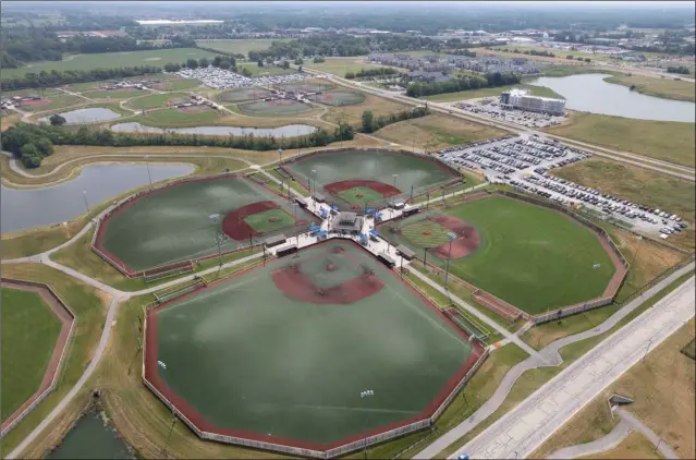  ?? Photo by A.J. Mast / The Washington Post ?? The youth sports industry is a $30-billion business and communitie­s like Westfield, Indiana are taking advantage of that. The Grand Park Sports Campus in Westfield boasts 26 baseball and softball diamonds and 31 soccer, football and lacrosse fields, The complex draws and estimated 2.5 million people a year.