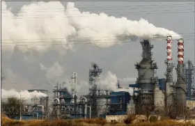  ?? (File Photo/AP/Olivia Zhang) ?? Smoke and steam rise Nov. 28, 2019, from a coal processing plant in Hejin in central China’s Shanxi Province.