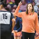  ?? JESSICA HILL/SPECIAL TO THE COURANT ?? Sun head coach Stephanie White gestures during an exhibition game against the Liberty on May 10 at Mohegan Sun in Uncasville.