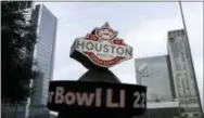  ?? DAVID J. PHILLIP — THE ASSOCIATED PRESS ?? This photo shows a countdown sign leading up to Super Bowl LI in Discovery Green park in downtown Houston. Super Bowl LI will be played Feb. 5 at NRG Stadium in Houston.