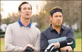  ??  ?? Noah Wyle (left) stars alongside Christian Kane, one of the altruistic ne’er-dowells on “Leverage: Redemption,” a reboot of the show from 2008-2012.