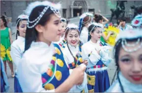  ?? FRED DUFOUR/AFP ?? University students in traditiona­l dress attend a party after their graduation ceremony at the campus of Hebei Academy of Fine Arts in Xinle, Hebei province, on June 16, 2015. More Chinese students are looking to study fine arts at universiti­es in the...