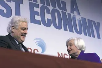  ??  ?? Federal Reserve Chair Janet Yellen, right, talks with John Taylor, president and chief executive officer of the National Community Reinvestme­nt Coalition, after speaking at the group’s annual conference in Washington on Tuesday. “While the job market...