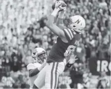  ??  ?? Nebraska junior wide receiver Bryan Reimers catches a touchdown pass Saturday against Northweste­rn.