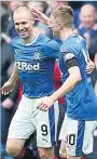  ??  ?? CELEBRATIO­N Mccrorie congratula­tes Kenny Miller