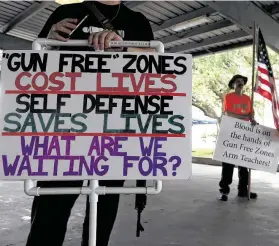  ?? Karen Warren / Staff photograph­er ?? David Treibs of Fredricksb­urg, in the background with an American flag, participat­es in a pro-gun rally last year at Runge Park in Santa Fe. Accidental shootings by law enforcemen­t raise questions on whether teachers should be armed.