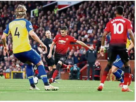  ?? — Reuters ?? Take that: Manchester United’s Andreas Pereira scoring their first goal against Southampto­n in the Premier League match on Saturday.