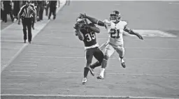  ?? AP ?? The Eagles' Boston Scott, left, catches the go-ahead touchdown pass against the Giants' Jabrill Peppers with 40 seconds remaining on Thursday night.