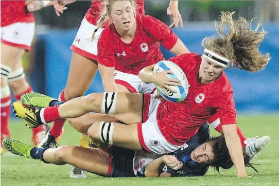  ?? SEAN KILPATRICK/THE CANADIAN PRESS/FILES ?? Canada’s Karen Paquin, seen playing against Britain in rugby sevens at the 2016 Olympic Games in Rio de Janeiro, says she left a “very organized and very supported” sevens group to try to win a Women’s Rugby World Cup with the national 15s team. The...