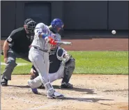  ?? ADAM HUNGER - THE ASSOCIATED PRESS ?? New York Mets’ Robinson Cano hits a two-run home run against the New York Yankees during the fifth inning of the first baseball game of a doublehead­er, Sunday, Aug. 30, 2020, in New York.