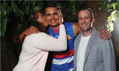  ??  ?? Jamarra Ugle-Hagan poses for a photograph with parents Alice and Aaron after being announced as the No 1 pick. Photograph: Michael Willson/AFL Photos/Getty Images
