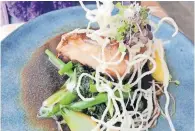  ?? ?? CAPE salmon on wilted greens with a soy and miso sauce at 3603.