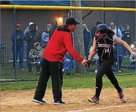  ?? BILL RUDICK — DIGITAL FIRST MEDIA ?? Coatesvill­e catcher Ashley Mendenhall is congratula­ted by head coach, and father, Bill, after she homered against Bishop Shanahan on Friday at Caln Park.