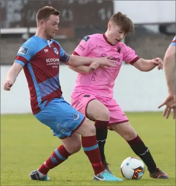 ??  ?? Danny Doyle of Wexford F.C. battling for the ball with Drogheda United’s Luke Gallagher.