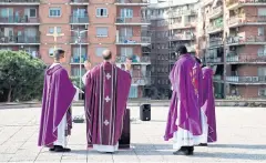  ?? AFP ?? Four priests celebrate Sunday Holy Mass from the roof of the church San Gabriele dell’Addolorata in Rome.