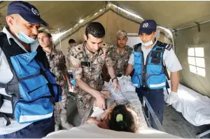  ?? Reuters ?? A displaced Syrian child receives treatment at a Jordanian military medical outpost near the Jordanian-Syrian Joint Border, near Jaber crossing, in the city of Mafraq, Jordan. —