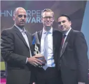  ??  ?? HSBC’s Daniel Robinson flanked by (left) the Bank’s CS Manager Glenn Bugeja holding the John Harper Award and JAYE Malta chairman Karl Briffa.