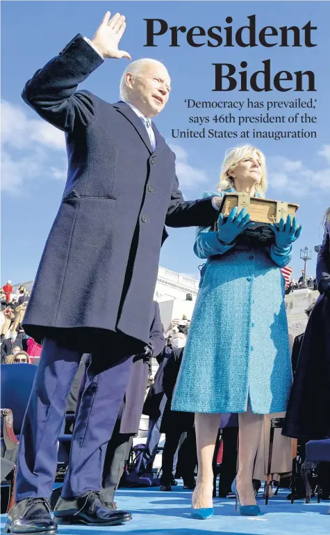  ?? ANDREW HARNIK/AP ?? Joe Biden is sworn in as the 46th president of the United States as Jill Biden holds the Bible in Washington on Wednesday.