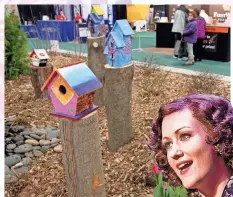  ?? MICHAEL SEARS/MILWAUKEE JOURNAL SENTINEL ?? Studentdes­igned birdhouses brighten up a garden display at the 2017 Realtors Home and Garden Show. The 2018 show starts Friday at State Fair Park.