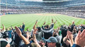  ?? YANKEE STADIUM PHOTO ?? Fans cheer their team on at Yankee Stadium in the Bronx, N.Y.