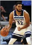  ?? AP/JIM MONE ?? Karl-Anthony Towns of the Minnesota Timberwolv­es finished with 14 points in a 112-105 loss to the Toronto Raptors on Tuesday, going just 5 of 17 from the field and 1 of 5 from the three-point line.