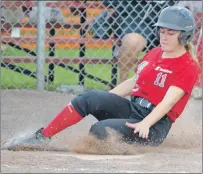  ?? ERIC MCCARTHY/JOURNAL PIONEER ?? Like Emily Cairns sliding home, the Scotiabank Reds have slid safely into first place at the end of the round-robin schedule of the Softball Canada national senior women’s fastpitch championsh­ip at Ellis Field in O’Leary.