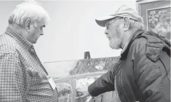  ?? MILLICENT MCKAY/JOURNAL PIONEER ?? Art Lockhart, right, raises his concerns to chief engineer Stephen Yeo for the Granville Street/Route 2 roundabout constructi­on.