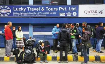  ?? Reuters ?? Aid needed Stranded tourists at a ticket office after their flights were cancelled a day after the earthquake in Kathmandu. Nepal has little scope to fund a major reconstruc­tion effort on its own.