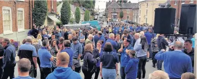  ??  ?? Crowds out in Montgomery, Powys, yesterday to support the search for missing man James Corfield