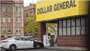  ?? CORNELIUS FROLIK / STAFF ?? A customer walks out of the Dollar General store at 445 Salem Ave. in northwest Dayton.