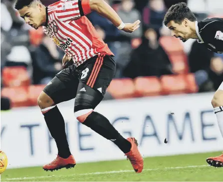  ??  ?? Tyias Browning keeps possession under pressure against Fulham on Saturday. Picture by Frank Reid.