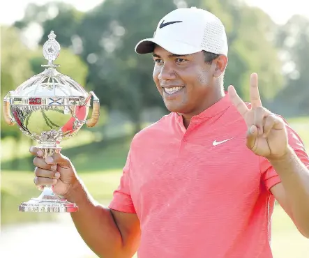  ?? NATHAN DENETTE/THE CANADIAN PRESS ?? Jhonattan Vegas holds his trophy after his win at the RBC Canadian Open in Oakville, Ont., on Sunday.