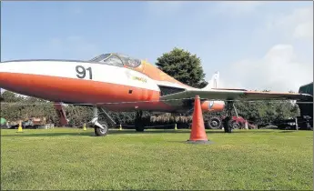  ??  ?? Chris Davies of Tacla Taid Transport Museum at Newborough, below, with the 1955 Hawker Hunter gate guardian, recently moved from RAF Valley