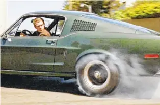  ?? WARNER BROS. PHOTO ?? Not only did “Bullitt” give actor Steve McQueen one of his most famous roles; it also made a star of the 1968 Ford Mustang he drove as tough-guy police detective Frank Bullitt.