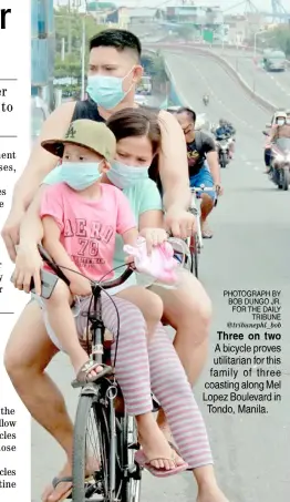  ?? PHOTOGRAPH BY BOB DUNGO JR. FOR THE DAILY TRIBUNE ?? @tribunephl_bob Three on two A bicycle proves utilitaria­n for this family of three coasting along Mel Lopez Boulevard in Tondo, Manila.