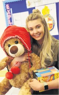  ??  ?? Teddy to help Kerrie Davidson, 19, at the Children in Distress fundraiser.