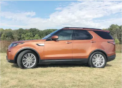  ?? ROBERT DUFFER ?? The fifth-generation 2017 Land Rover Discovery in Namib Orange is a three-row SUV powered by a V-6 diesel engine with all sorts of technologi­cal convenienc­es that help define luxury.