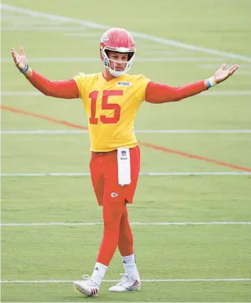  ?? COLIN E. BRALEY/AP ?? Chiefs QB Patrick Mahomes reacts at the team’s training camp facility on Sunday in St. Joseph, Mo.