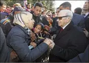  ?? SLIM ABID / TUNISIAN PRESIDENCY ?? Tunisian President Beji Caid Essebsi greets bystanders Sunday in Tunis. Tunisia was marking seven years since its autocratic ruler fled into exile.