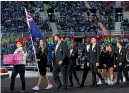  ?? GETTY IMAGES ?? Flagbearer­s Joelle King and Tom Walsh lead out the New Zealand team at the opening ceremony.