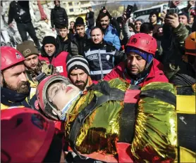  ?? ISMAIL COSKUN - VIA THE ASSOCIATED PRESS ?? Rescuers carry Zeynep Polat, pulled out from a collapsed building, days after the earthquake in Kahramanma­ras, southern Turkey, on Thursday. Rescue teams worked through the night in Turkey and Syria, pulling more bodies from the rubble of thousands of buildings toppled by a catastroph­ic earthquake.