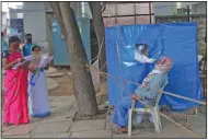  ?? (AP/Mahesh Kumar A.) ?? A health worker conducts a coronaviru­s test Saturday in Hyderabad, India. India has the third-highest caseload after the United States and Brazil and has been reporting the biggest daily rise in cases for 18 days in a row.