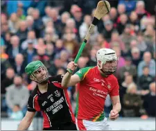  ??  ?? Liam Ryan of Rapparees wins this duel with county colleague Shaun Murphy (Oulart-The Ballagh).