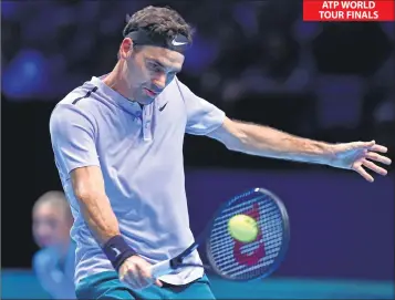  ??  ?? Roger Federer returns against Alexander Zverev during their men's singles round-robin match on day three of the ATP World Tour Finals at the O2 Arena in London.