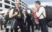  ?? DOUGLAS HANKS dhanks@miamiheral­d.com ?? Team members carried a three-day supply of food and clothing. Left, Myles Kaplan, a county paramedic, totes a ‘life pack’ that has a heart monitor and defibrilla­tor. On the right is Chris Pecori, with breathing equipment.